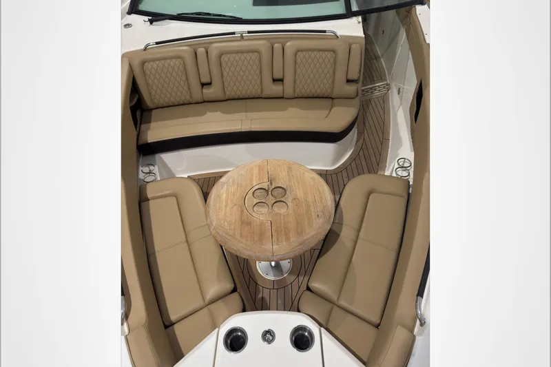  Yacht Photos Pics 2021 Sea Ray SLX 400 boat interior with tan seating and wooden table.