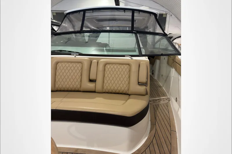  Yacht Photos Pics 2021 Sea Ray SLX 400 boat interior with tan leather seating and wooden deck.