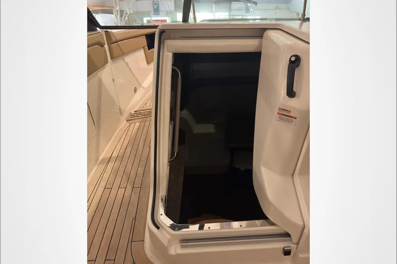  Yacht Photos Pics 2021 Sea Ray SLX 400 cabin entrance with teak flooring and open door.