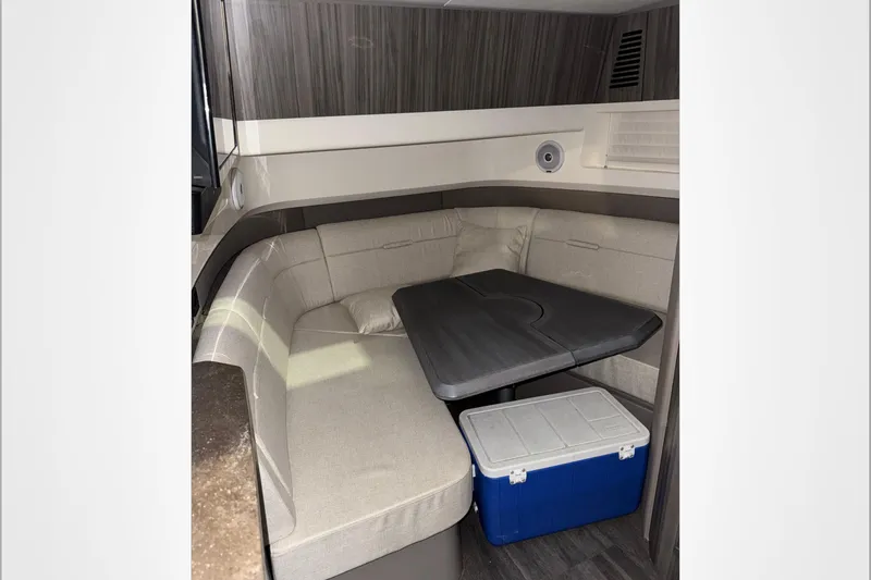  Yacht Photos Pics Interior of 2021 Sea Ray SLX 400 boat with seating, table, and cooler.