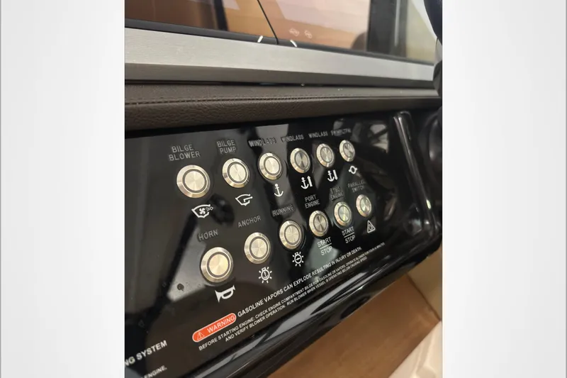  Yacht Photos Pics Control panel of a 2021 Sea Ray SLX 400 boat with various function buttons.