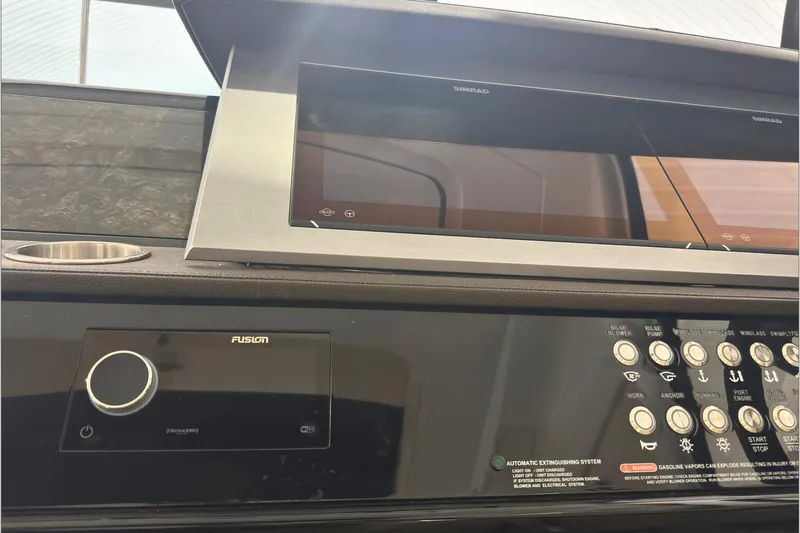  Yacht Photos Pics Control panel of a 2021 Sea Ray SLX 400 boat with navigation and audio systems.