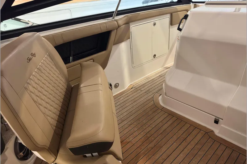  Yacht Photos Pics 2021 Sea Ray SLX 400 interior with tan leather seating and teak flooring.