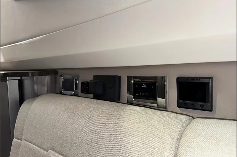  Yacht Photos Pics Interior controls of a 2021 Sea Ray SLX 400 boat, featuring modern panel design.