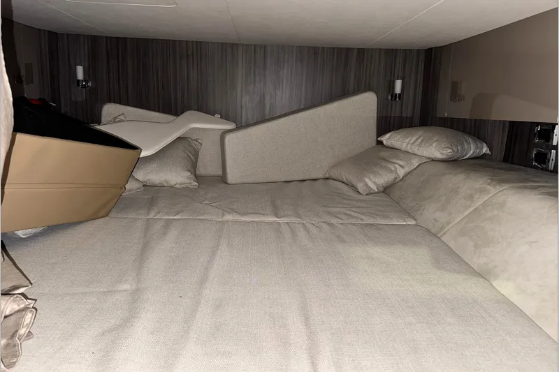  Yacht Photos Pics Interior cabin of 2021 Sea Ray SLX 400 with beige cushions and pillows.