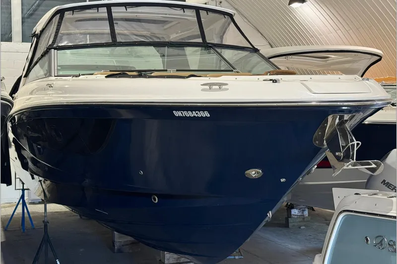  Yacht Photos Pics 2021 Sea Ray SLX 400 boat in indoor storage, front view.