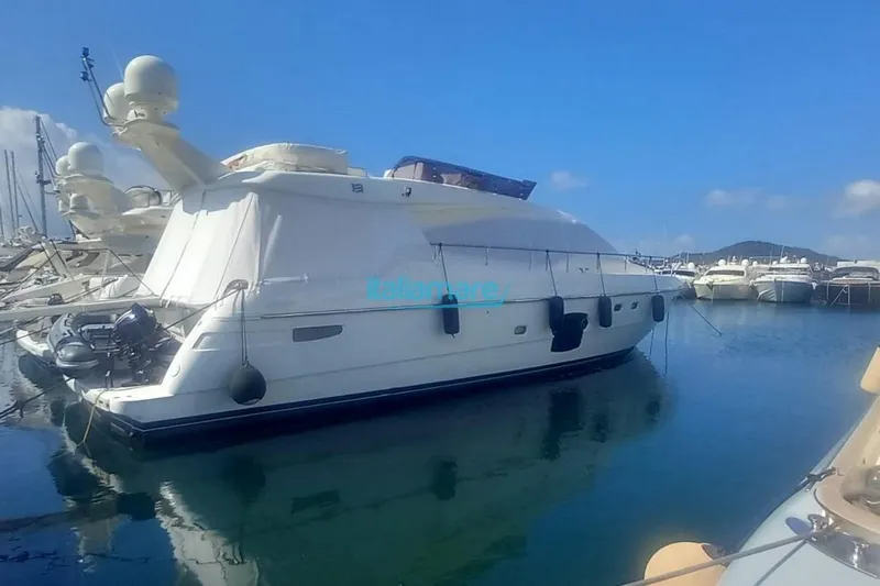  Yacht Photos Pics 2008 Ferretti Yachts 592 docked in a marina under clear blue skies.