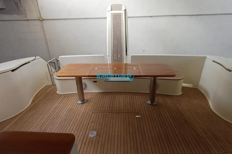  Yacht Photos Pics 2008 Ferretti Yachts 592 interior with wooden flooring and table.