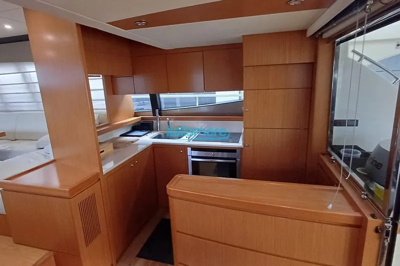  Yacht Photos Pics Interior of 2008 Ferretti Yachts 592, featuring a modern kitchen with wood cabinetry.