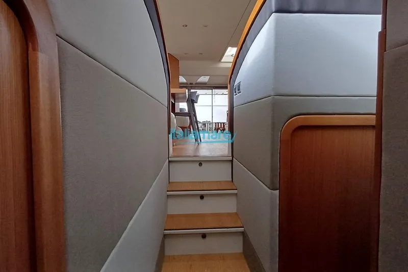  Yacht Photos Pics Interior view of 2008 Ferretti Yachts 592, featuring elegant wooden stairs and modern design.