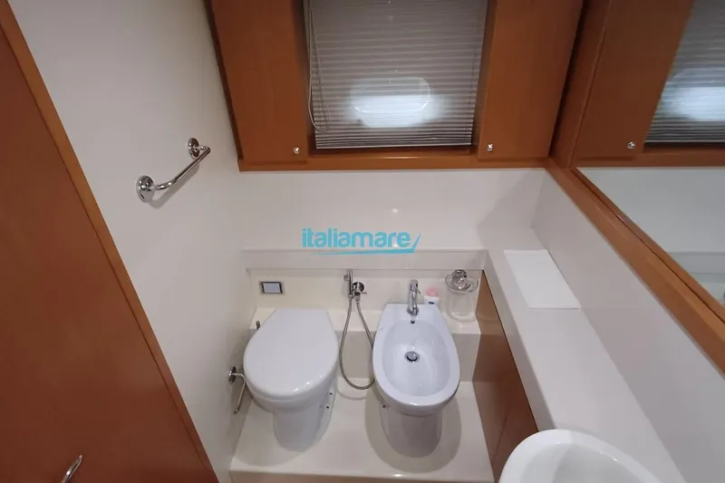  Yacht Photos Pics Luxurious bathroom in 2008 Ferretti Yachts 592, featuring modern fixtures and elegant design.