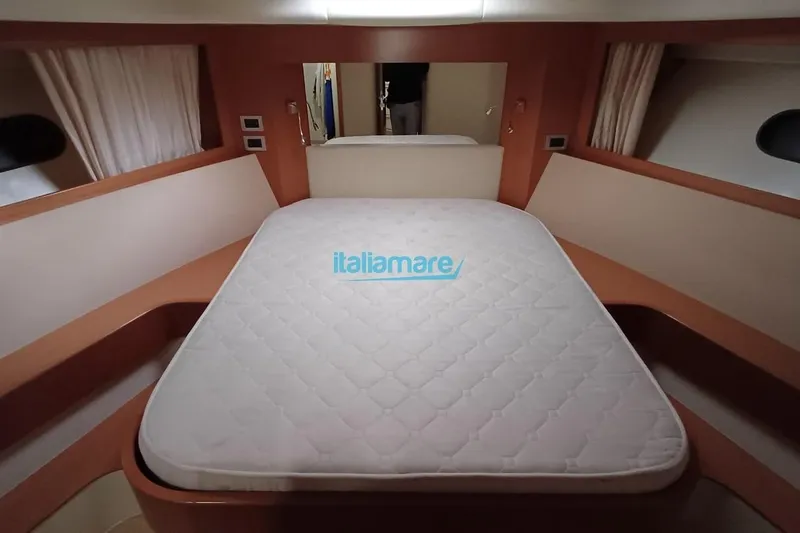  Yacht Photos Pics Luxurious bedroom interior of 2008 Ferretti Yachts 592 with a comfortable bed.