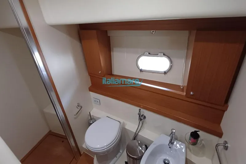  Yacht Photos Pics Bathroom interior of 2008 Ferretti Yachts 592, featuring modern fixtures and wooden accents.