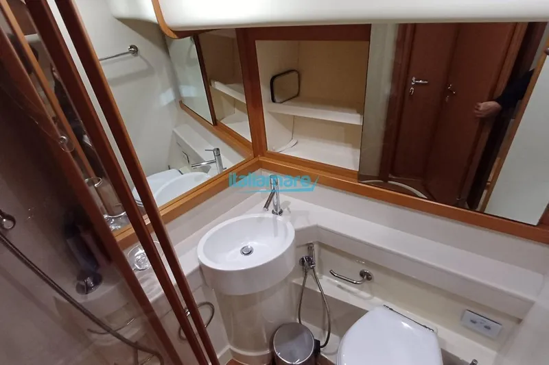  Yacht Photos Pics Luxurious bathroom in 2008 Ferretti Yachts 592 with modern fixtures and elegant design.