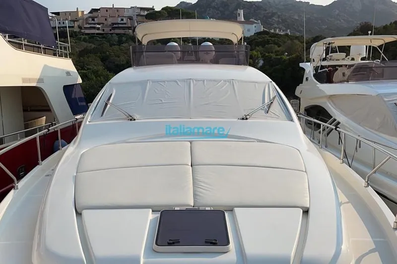  Yacht Photos Pics 2008 Ferretti Yachts 592 docked, featuring sleek design and spacious deck area.