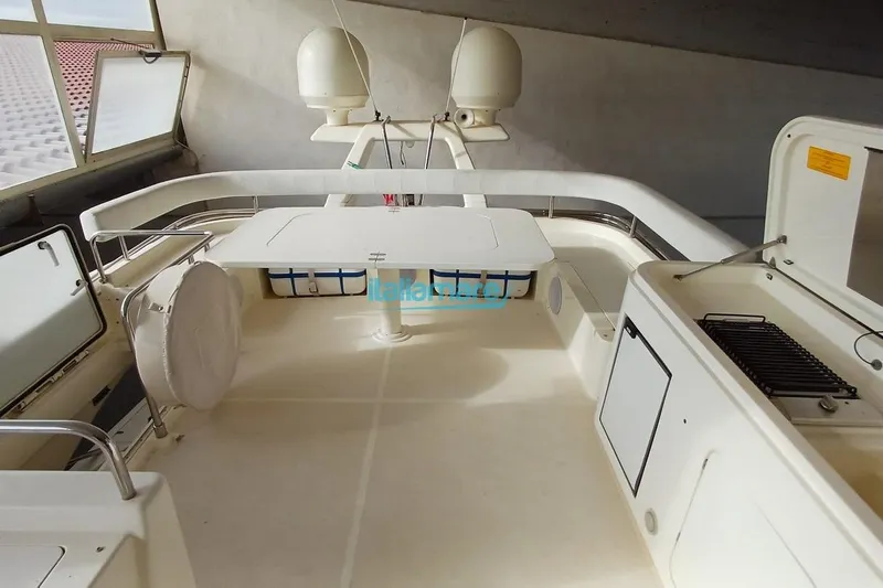  Yacht Photos Pics 2008 Ferretti Yachts 592 deck with seating and storage compartments.