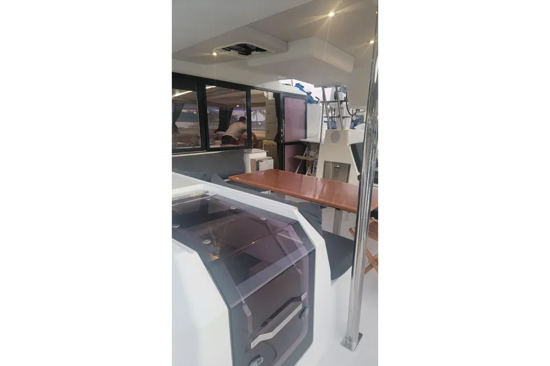 Three Sheets Yacht Photos Pics 2019 Fountaine Pajot Saona 47 yacht interior with modern design and wooden table.