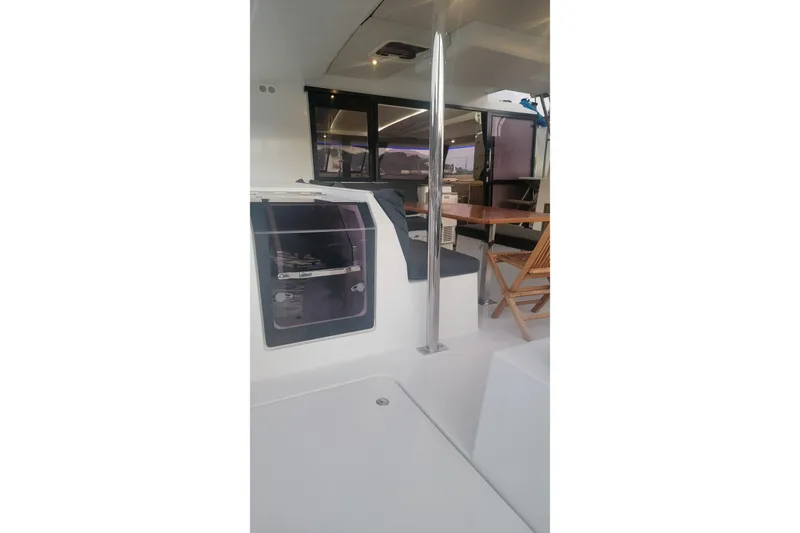 Three Sheets Yacht Photos Pics Interior view of 2019 Fountaine Pajot Saona 47 catamaran with seating and table.
