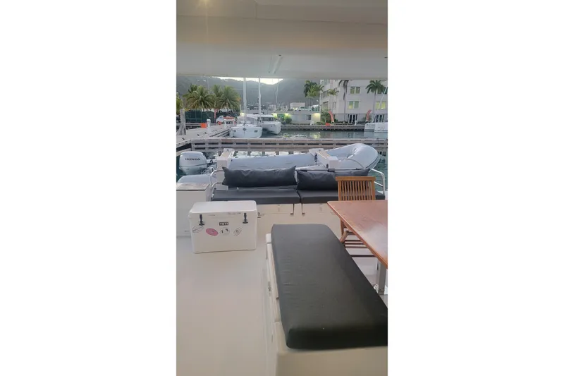 Three Sheets Yacht Photos Pics 2019 Fountaine Pajot Saona 47 yacht deck with seating and marina view.