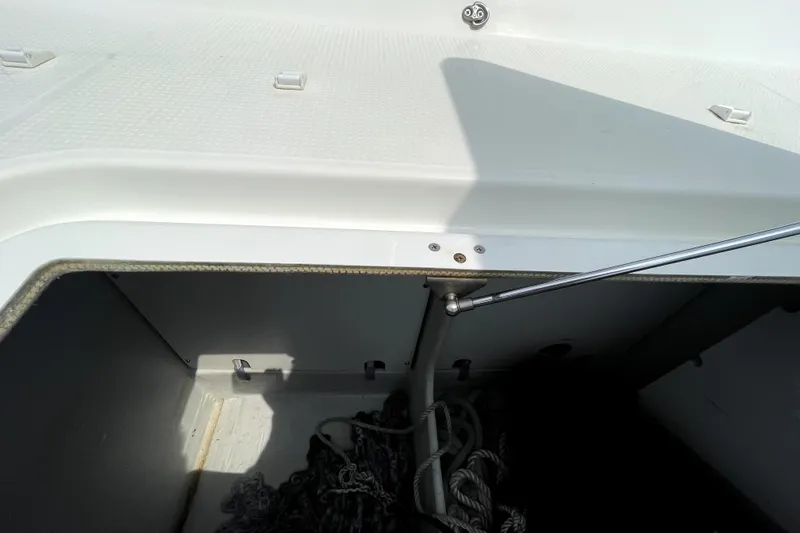 Three Sheets Yacht Photos Pics Storage compartment on a 2019 Fountaine Pajot Saona 47 catamaran, featuring ropes and hardware.