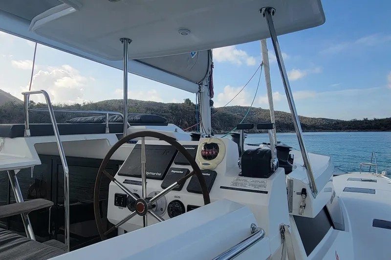 Three Sheets Yacht Photos Pics 2019 Fountaine Pajot Saona 47 yacht helm with scenic ocean view.