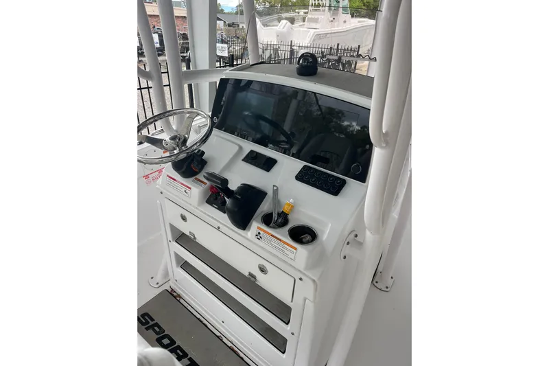  Yacht Photos Pics 2024 Sportsman Open 212 Center Console dashboard with steering wheel and controls.