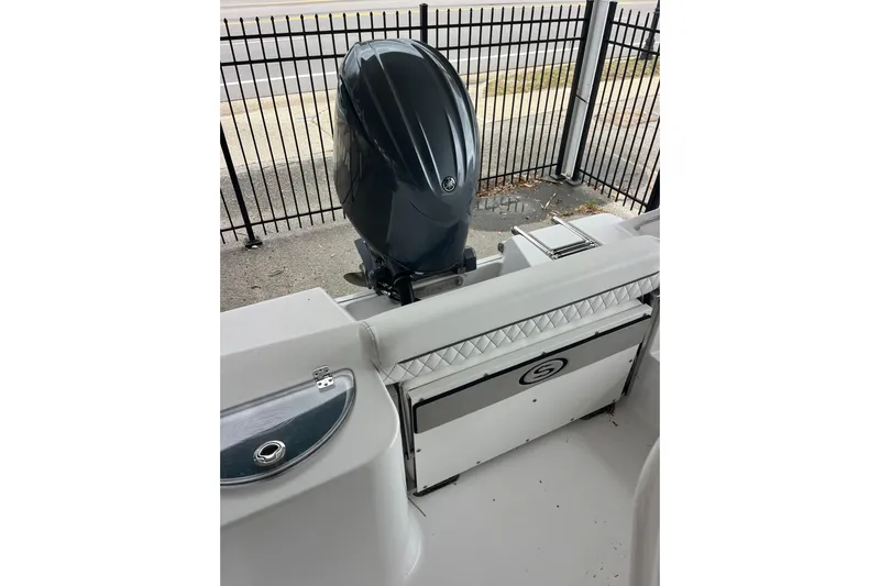  Yacht Photos Pics 2024 Sportsman Open 212 Center Console boat with outboard motor and seating.