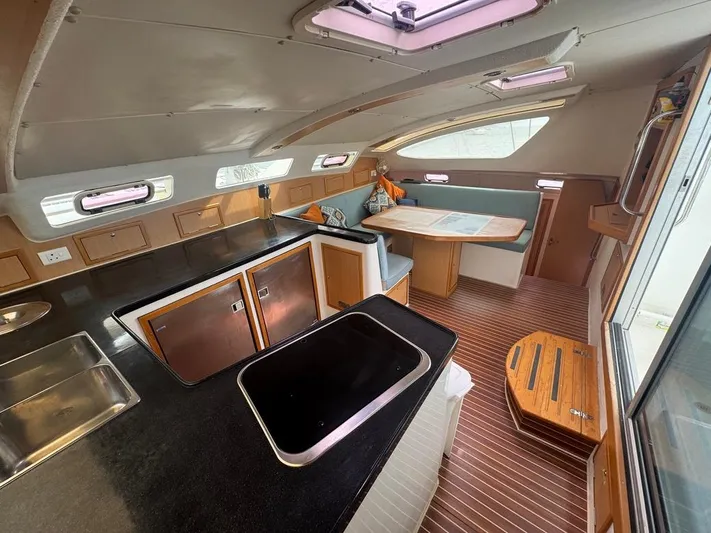 Avatar Yacht Photos Pics Interior of 2010 Admiral 38 Executive yacht with modern kitchen and dining area.