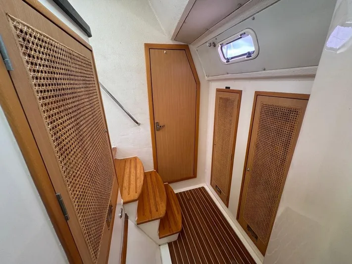 Avatar Yacht Photos Pics Interior of 2010 Admiral 38 Executive yacht with wooden cabinetry and steps.