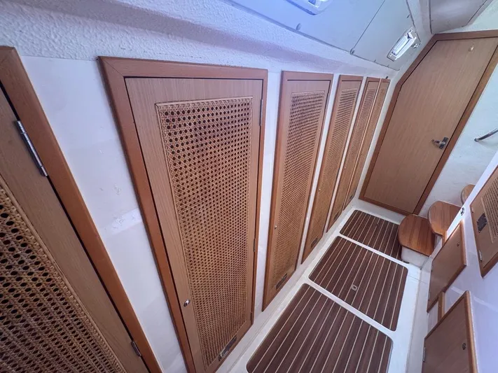 Avatar Yacht Photos Pics Interior of 2010 Admiral 38 Executive yacht with wooden paneling and flooring.