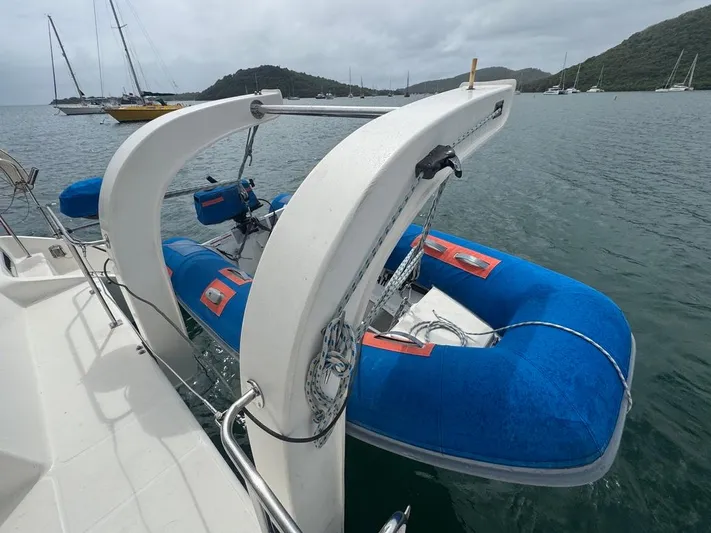 Avatar Yacht Photos Pics Blue inflatable boat on Admiral 38 Executive yacht, 2010 model, docked in scenic harbor.