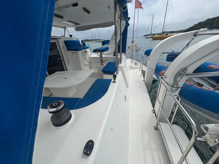 Avatar Yacht Photos Pics 2010 Admiral 38 Executive yacht with blue accents docked in a scenic marina.