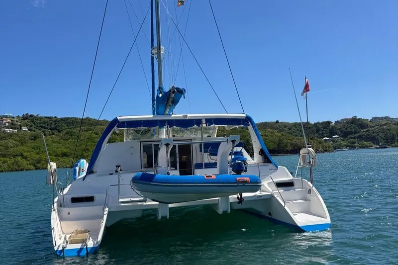 Avatar Yacht Photos Pics 2010 Admiral 38 Executive catamaran anchored in scenic waters.