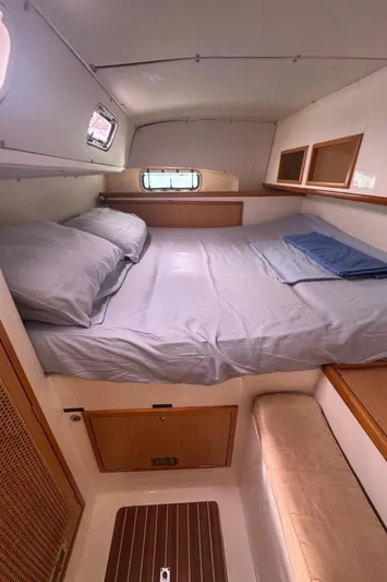 Avatar Yacht Photos Pics Cozy cabin interior of 2010 Admiral 38 Executive yacht with bed and storage.
