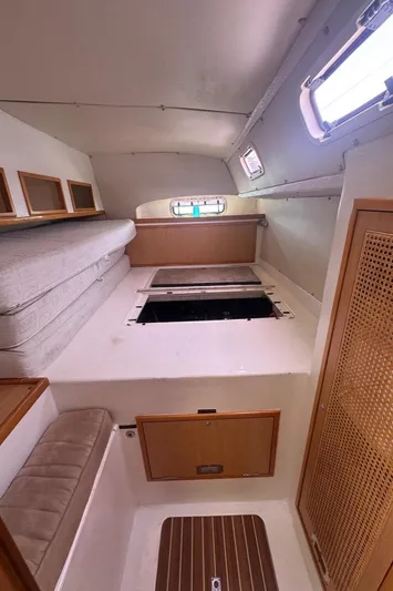 Avatar Yacht Photos Pics Interior of 2010 Admiral 38 Executive yacht with cozy seating and storage.