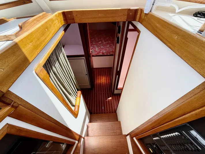  Yacht Photos Pics Interior view of 2006 Mast & Mallet Thomas Point 40 boat with wooden stairs and cabin.