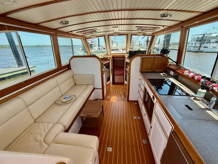  Yacht Photos Pics Luxurious interior of 2006 Mast & Mallet Thomas Point 40 yacht with elegant wood finishes.
