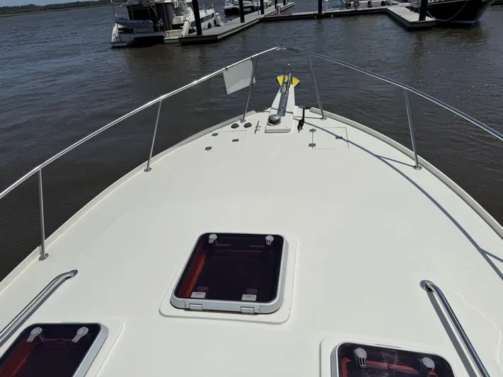  Yacht Photos Pics Bow view of 2006 Mast & Mallet Thomas Point 40 docked at marina.