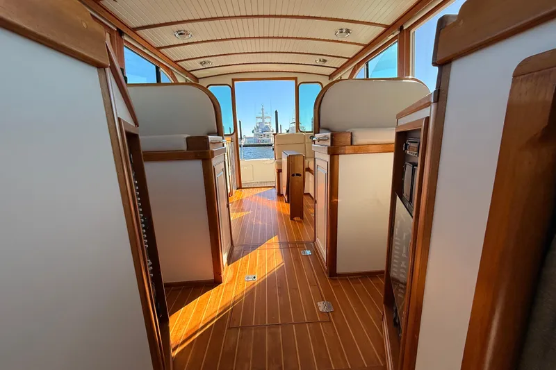  Yacht Photos Pics Interior of 2006 Mast & Mallet Thomas Point 40 boat with wooden finishes and spacious layout.