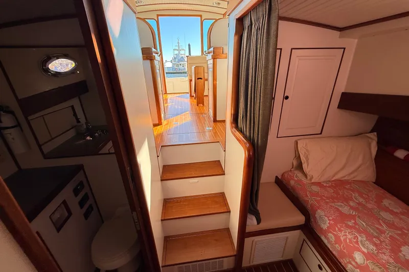  Yacht Photos Pics Interior of 2006 Mast & Mallet Thomas Point 40 boat, featuring cozy cabin and wooden stairs.