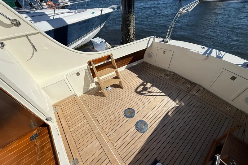  Yacht Photos Pics Spacious deck of 2006 Mast & Mallet Thomas Point 40 boat, featuring wooden flooring.