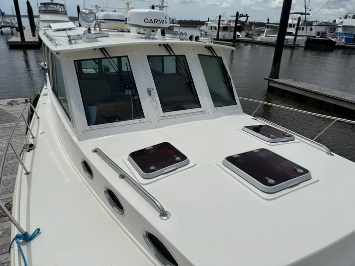  Yacht Photos Pics 2006 Mast & Mallet Thomas Point 40 boat docked at marina, featuring Garmin equipment.