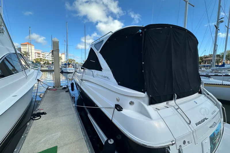 Beyond The Reef Yacht Photos Pics 2008 Regal Commodore 4060 yacht docked at marina under clear blue sky.