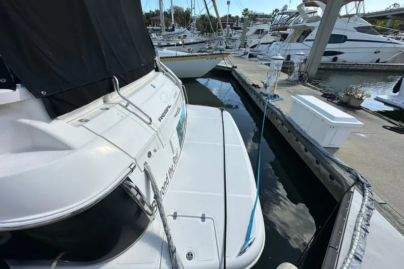 Beyond The Reef Yacht Photos Pics 2008 Regal Commodore 4060 yacht docked at marina, surrounded by other boats.