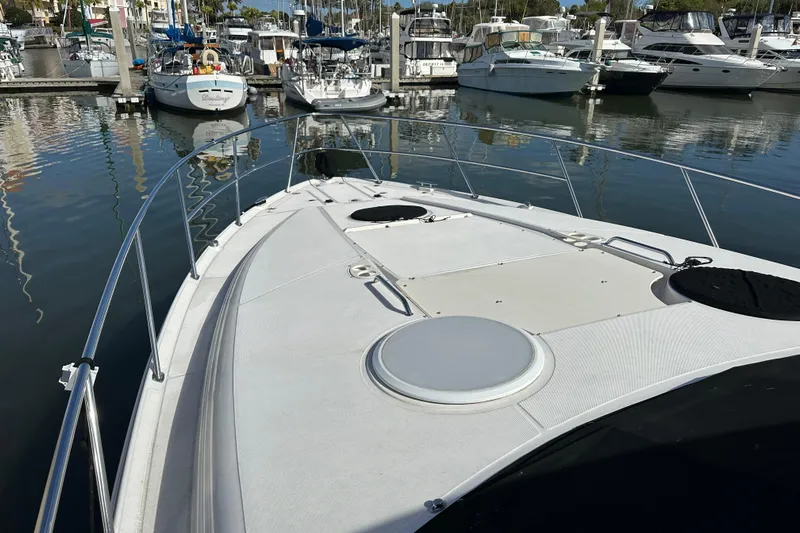 Beyond The Reef Yacht Photos Pics 2008 Regal Commodore 4060 yacht docked in marina, surrounded by other boats.