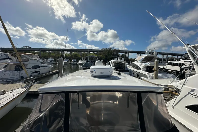 Beyond The Reef Yacht Photos Pics 2008 Regal Commodore 4060 yacht docked at marina under blue sky.