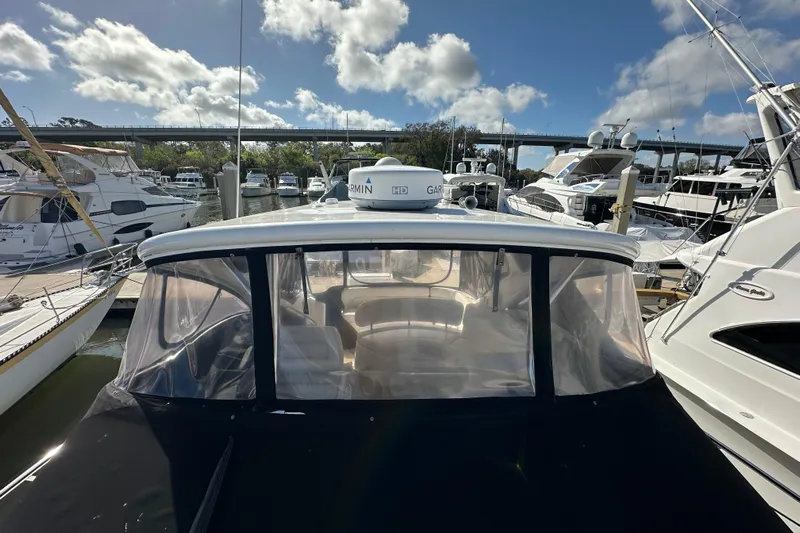 Beyond The Reef Yacht Photos Pics 2008 Regal Commodore 4060 yacht docked at marina under blue sky.