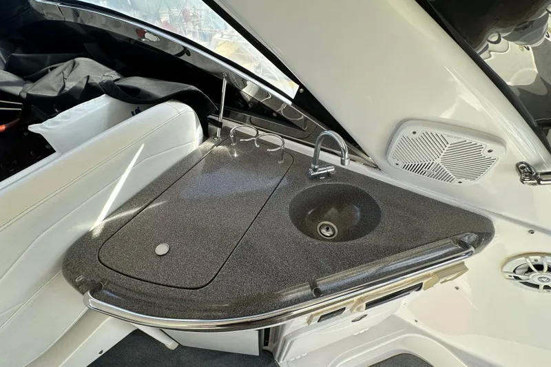 Beyond The Reef Yacht Photos Pics 2008 Regal Commodore 4060 boat interior with sleek kitchenette and modern sink design.