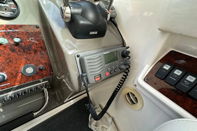 Beyond The Reef Yacht Photos Pics Control panel of a 2008 Regal Commodore 4060 boat with radio and switches.