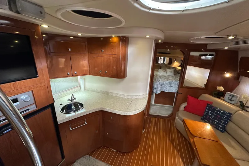 Beyond The Reef Yacht Photos Pics Luxurious interior of 2008 Regal Commodore 4060 yacht with wood cabinetry and cozy seating.
